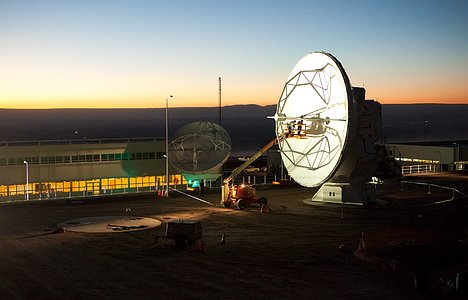 ALMA antennas and OSF at sunset