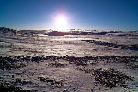 Sunrise over a Snow-Covered Desert
