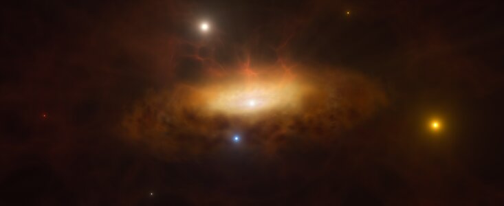 This artist’s impression shows a ring of dark yellow clouds surrounding a brighter yellow region, with an especially bright white dot at its centre, on a dark background. Bright yellow, red, white, and blue stars dot the image.