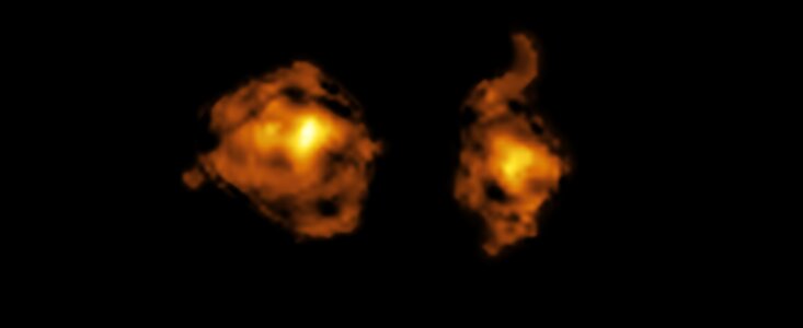 This is a telescopic image of two galaxies, shown as bright clouds of swirling gas. Against the pitch-dark backdrop of deep space, these two blotchy clouds take up most of the picture, and they are shown in bright yellows and oranges that get more intense at their centres and fade towards their edges.