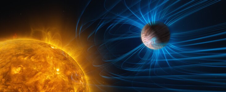 An illustration of a planet orbiting a star. The star is a huge yellow sphere with a hot “bubbling” surface. The planet is a gas giant, completely covered with clouds that are smeared due to the planet’s fast winds. The planet is surrounded by a magnetic shield of sorts, depicted with blue lines curving away from the star.