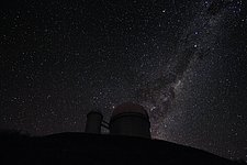 The Milky Way and Alpha and Beta Centauri behind the 3.6-metre telescope at La Silla