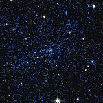 Composite of X-ray and visible light views of a distant cluster of galaxies