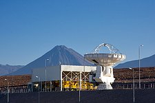 ALMA antenna at OSF, in front of Transporter Shelter and Licancabur volcano