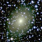 The galaxy ESO 137-10 peeks through a rich curtain of stars