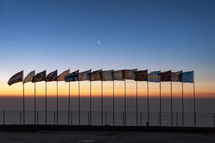 Flags atop Cerro Paranal