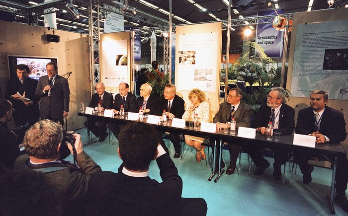 Richard West moderating a press conference