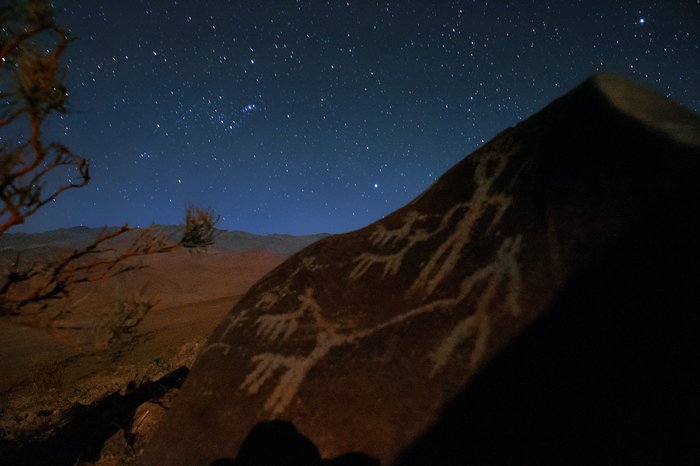 Orion raising over petroglyphs