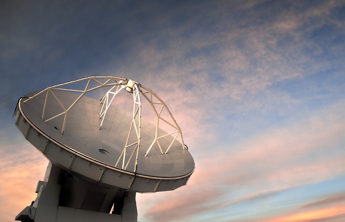 ALMA antenna against cloudy sunset