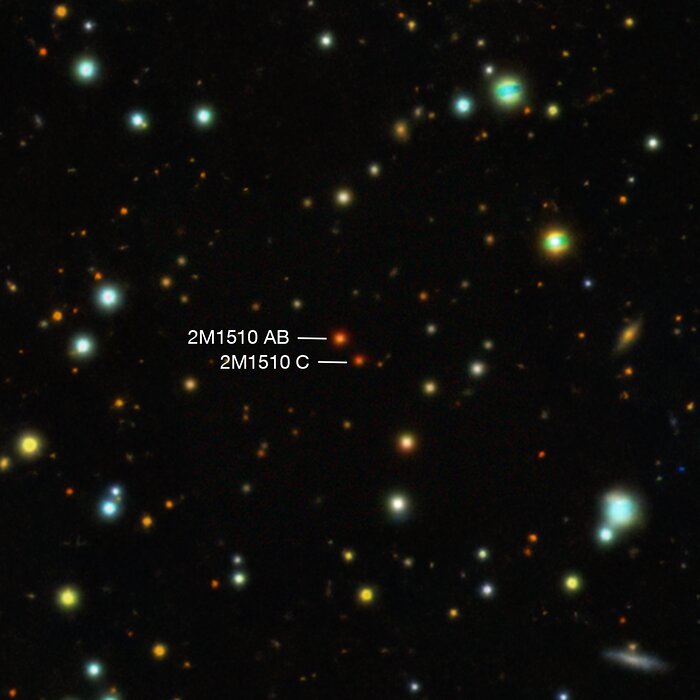 2M1510 AB, a pair of brown dwarfs with an exoplanet in a perpendicular orbit