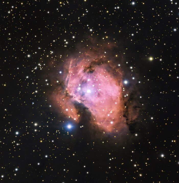 A bubblegum-pink nebula