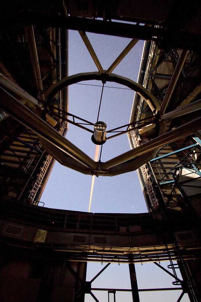 Laser beam creating an “artificial” star